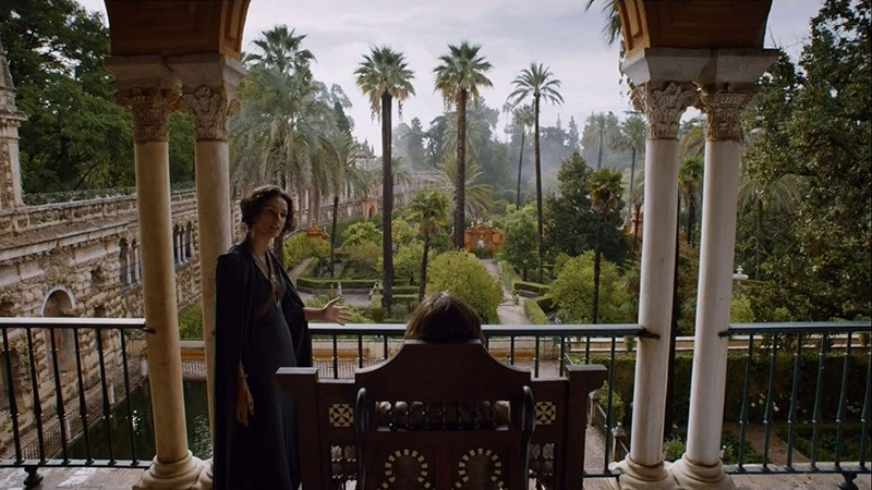 Rear image of Prince Doran looking over the palace gardens with Ellaria Sand stood by his side.